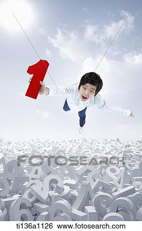 a kid flying in the air with red number one icon View Large Photo Image Stock Photograph - a kid flying in the air with red number one icon. Fotosearch