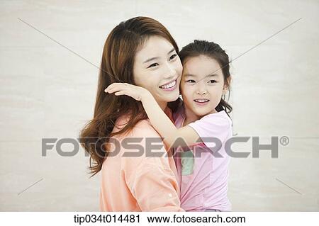 Stock Image - a kid hugging mother . Fotosearch