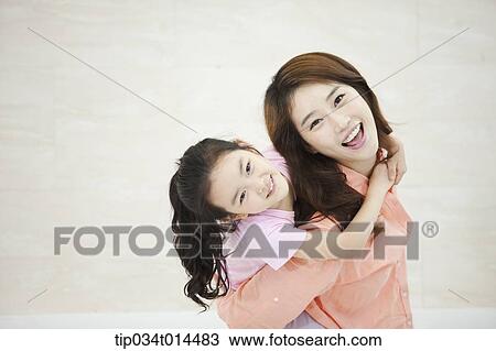 a kid hugging mother View Large Photo Image Stock Image - a kid hugging mother . Fotosearch