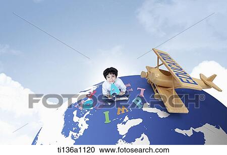 a kid sitting on a globe with alphabets View Large Photo Image Stock Image - a kid sitting on a globe with alphabets. Fotosearch