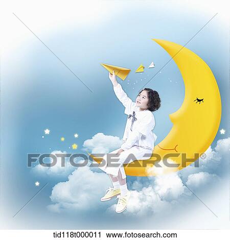 a kid sitting on a moon View Large Photo Image Stock Image - a kid sitting on a moon. Fotosearch