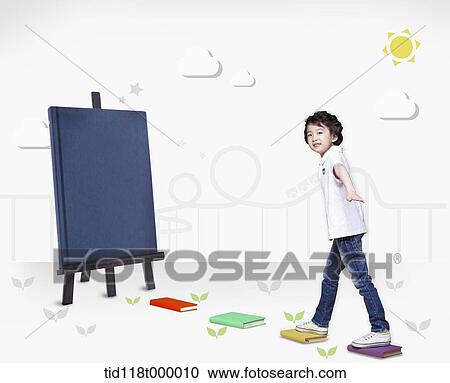 a kid walking on books leading to a black board View Large Photo Image Stock Image - a kid walking on books leading to a black board. Fotosearch
