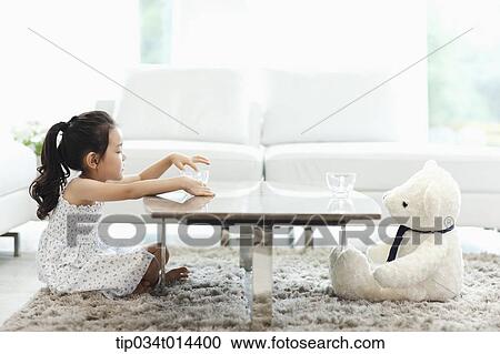 a kid with a teddy bear on the other end of table View Large Photo Image Stock Image - a kid with a teddy bear on the other end of table. Fotosearch