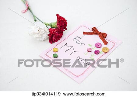 Stock Photo - a letter saying for my mom next to flowers. Fotosearch