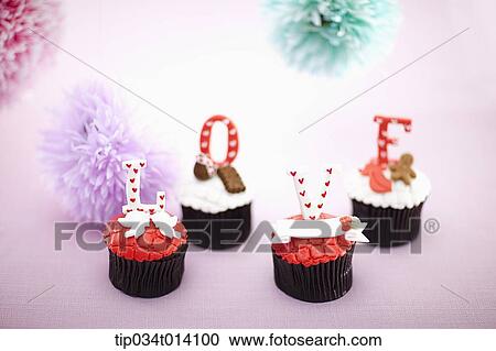 a letter saying love on top of cupcakes View Large Photo Image Stock Image - a letter saying love on top of cupcakes. Fotosearch