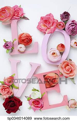 Stock Photo - a letter saying love with roses around. Fotosearch