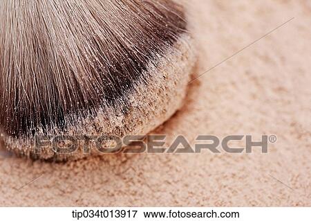 Stock Photo - a make up brush on face powder. Fotosearch