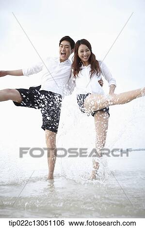 a man and a woman at a beach View Large Photo Image Stock Photograph - a man and a woman at a beach. Fotosearch