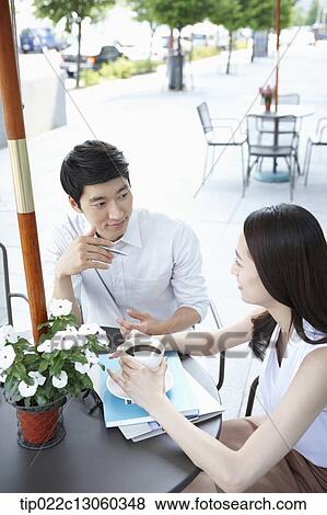 a man and a woman having a coffee View Large Photo Image Stock Photo - a man and a woman having a coffee. Fotosearch