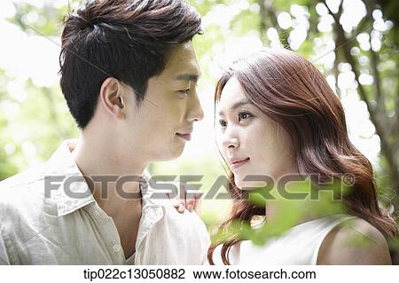 Stock Image - a man and a woman in the nature. Fotosearch