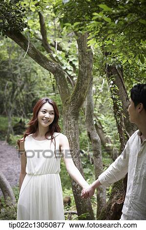 Stock Photo - a man and a woman in the nature. Fotosearch