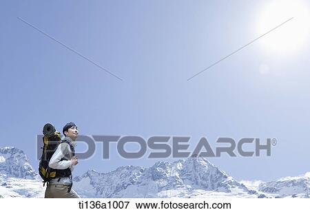 a man hiking in the mountains View Large Photo Image Stock Photo - a man hiking in the mountains. Fotosearch