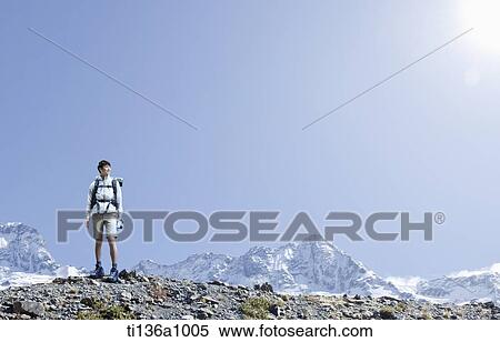 a man hiking in the mountains View Large Photo Image Stock Photography - a man hiking in the mountains. Fotosearch