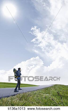 a man hiking on the road View Large Photo Image Stock Image - a man hiking on the road. Fotosearch