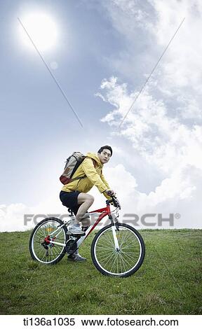 a man hiking with bikes View Large Photo Image Stock Photography - a man hiking with bikes. Fotosearch