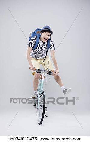 Stock Photography - a man playing on a bike. Fotosearch