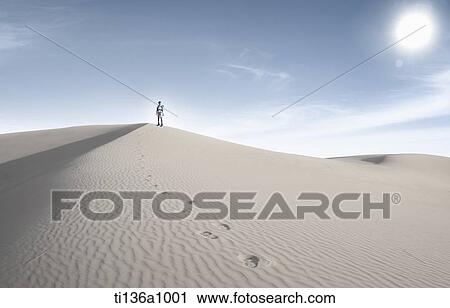 a man walking in the desert View Large Photo Image Stock Image - a man walking in the desert. Fotosearch