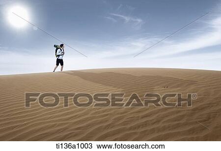 a man walking in the desert View Large Photo Image Stock Image - a man walking in the desert. Fotosearch