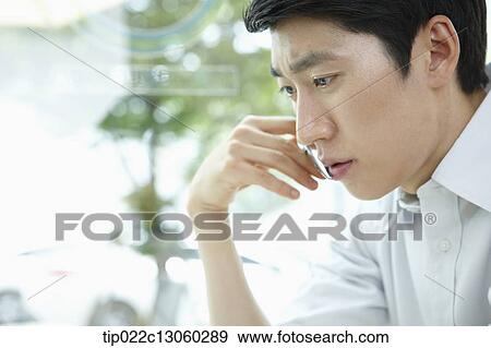a man with a white shirt thinking View Large Photo Image Stock Photo - a man with a white shirt thinking. Fotosearch
