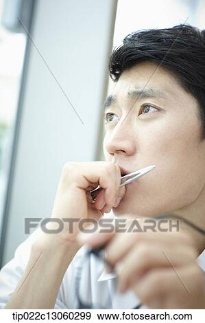 a man with a white shirt thinking View Large Photo Image Stock Photo - a man with a white shirt thinking. Fotosearch