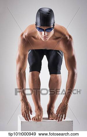 a man with swimming goggle and hat In swimming pose View Large Photo Image Stock Photo - a man with swimming goggle and hat In swimming pose. Fotosearch
