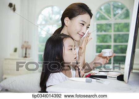 a mother and daughter on make up table View Large Photo Image Stock Image - a mother and daughter on make up table. Fotosearch