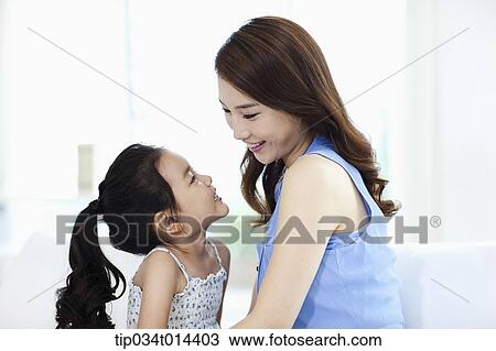 Stock Image - a mother and daughter playing together. Fotosearch
