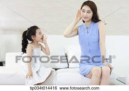 Stock Photograph - a mother and daughter playing together. Fotosearch