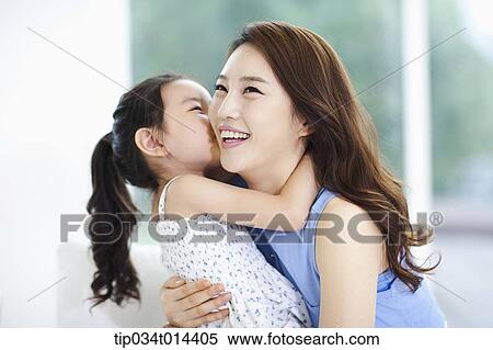 Stock Photography - a mother and daughter playing together. Fotosearch