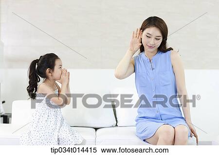Stock Photography - a mother and daughter playing together. Fotosearch