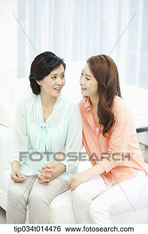 a mother talking with grown up daughter View Large Photo Image Stock Photograph - a mother talking with grown up daughter. Fotosearch