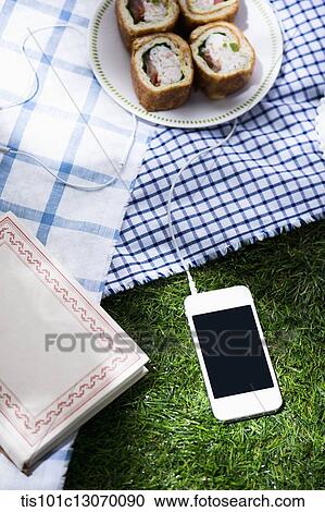 a picnic set and a phone spread out on a sheet View Large Photo Image Stock Image - a picnic set and a phone spread out on a sheet. Fotosearch