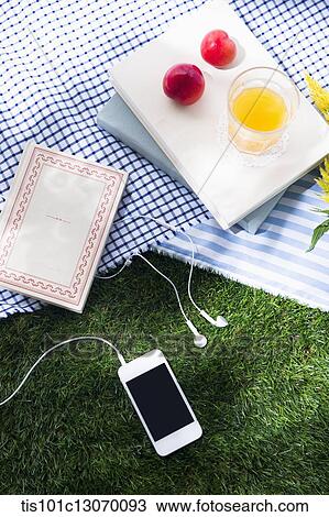 a picnic set and a phone spread out on a sheet View Large Photo Image Stock Image - a picnic set and a phone spread out on a sheet. Fotosearch