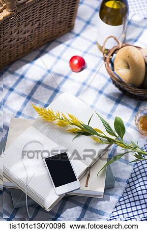 a picnic set and a phone spread out on a sheet View Large Photo Image Stock Photograph - a picnic set and a phone spread out on a sheet. Fotosearch