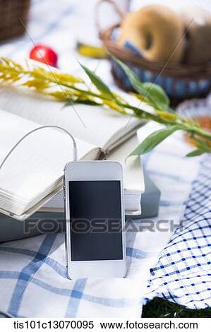 a picnic set and a phone spread out on a sheet View Large Photo Image Stock Photography - a picnic set and a phone spread out on a sheet. Fotosearch