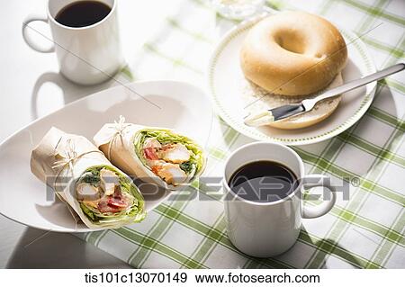 Stock Photo - a picnic set spread out on a sheet. Fotosearch