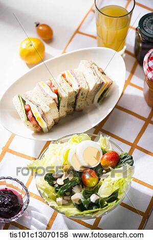 a picnic set spread out on a sheet View Large Photo Image Stock Photo - a picnic set spread out on a sheet. Fotosearch