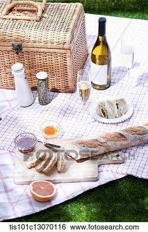 Stock Photograph - a picnic set spread out on a sheet. Fotosearch