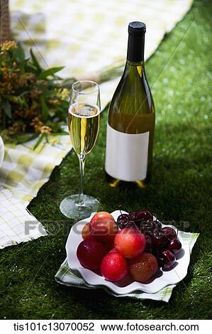 a picnic set with wine and fruits View Large Photo Image Stock Image - a picnic set with wine and fruits. Fotosearch