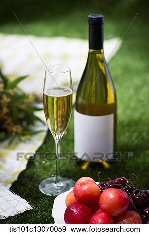 a picnic set with wine and fruits View Large Photo Image Stock Photo - a picnic set with wine and fruits. Fotosearch