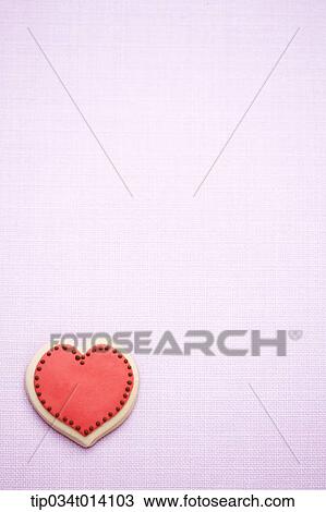 a red cookie in pink background View Large Photo Image Stock Image - a red cookie in pink background. Fotosearch