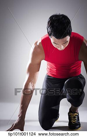 a runner in starting position View Large Photo Image Picture - a runner in starting position. Fotosearch