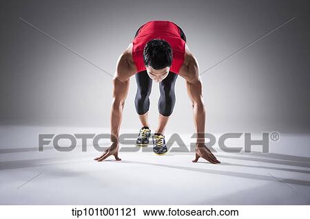 a runner in starting position View Large Photo Image Stock Image - a runner in starting position. Fotosearch