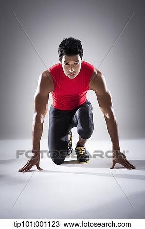 a runner in starting position View Large Photo Image Stock Image - a runner in starting position. Fotosearch