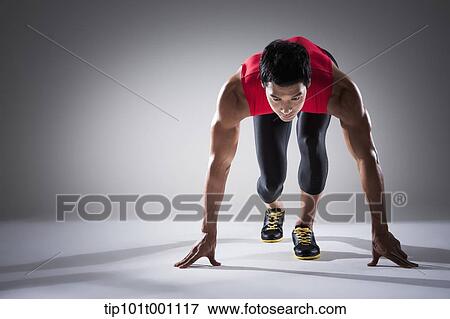 Stock Photo - a runner in starting position. Fotosearch