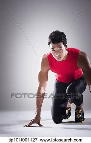 a runner in starting position View Large Photo Image Stock Photo - a runner in starting position. Fotosearch