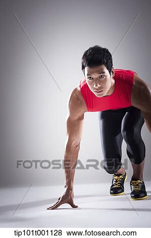 Stock Photo - a runner in starting position. Fotosearch