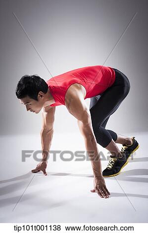 Stock Photo - a runner in starting position. Fotosearch