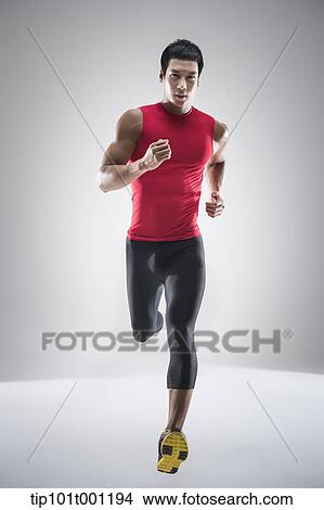 Picture - a runner jogging . Fotosearch