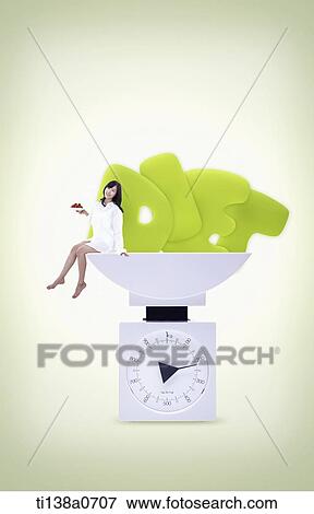 Stock Photo - a woman and the word diet on a scale. Fotosearch